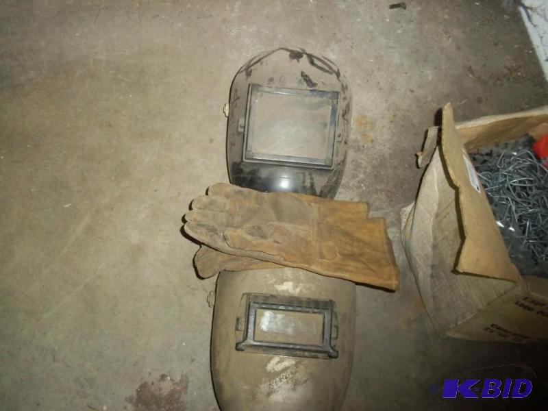 2 welding helmets and pair of welding gloves...