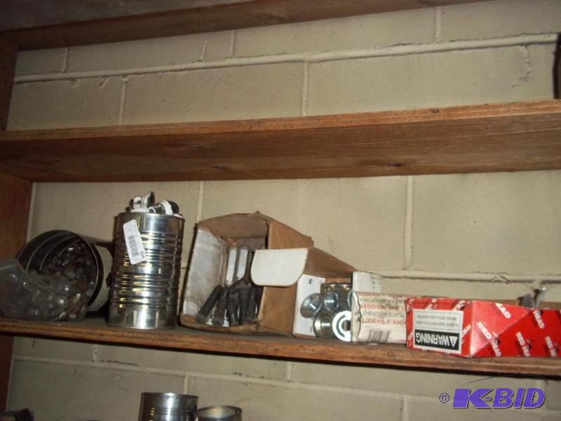 Shelf of Misc Parts   Wheel studs  Nuts  Ceme...
