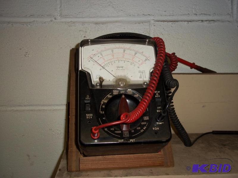Volt  Ohm meter with manual and stand, works...