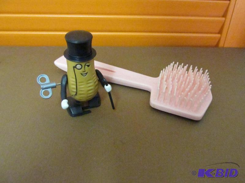 lot 107 image: Vintage Mr Peanut, wind-up and a Vintage Pink Stanley Brush