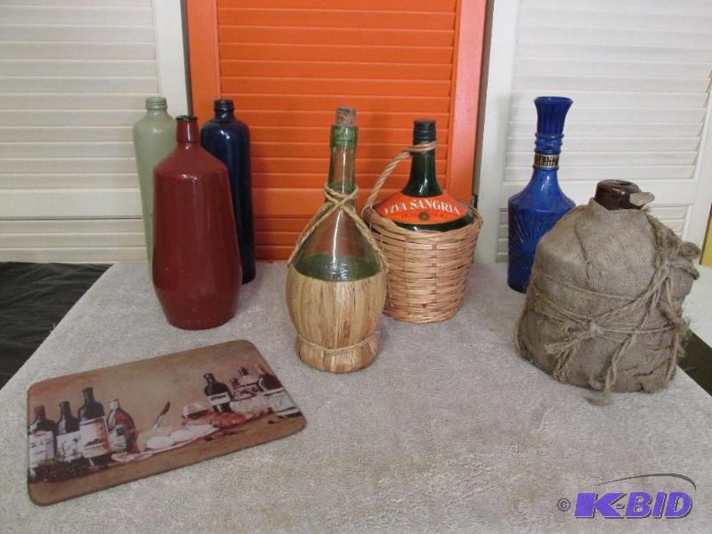 lot 109 image: Some Great Bottles and a Cutting Board.