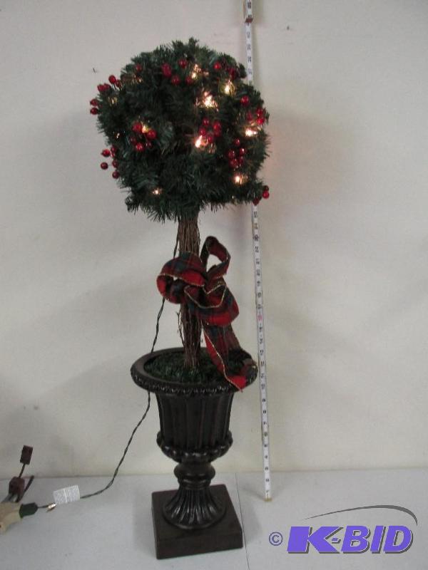 lot 15 image: Really nice Holiday Tree Dressed up with a pretty bow