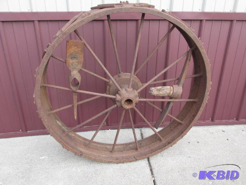 lot 2 image: Very Large Heavy Metal Wheel with 2 Pick-Axes in the Spokes