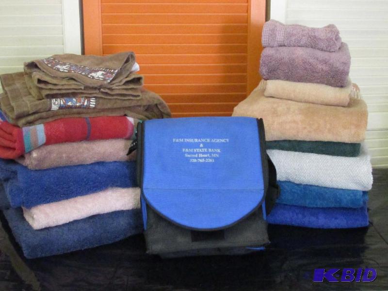lot 72 image: 2 Large Stacks of Towels and a Fold Up Cooler