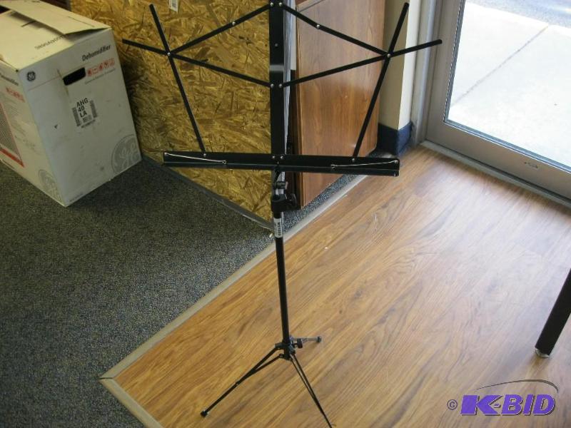 lot 15 image: Portable music stand and bag....