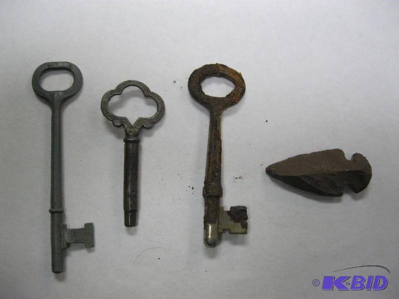 lot 27 image: Skeleton keys and arrow head....