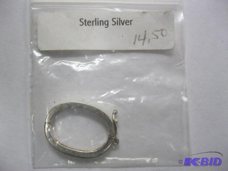 lot 35 image: Sterling silver ring with clasp. ...