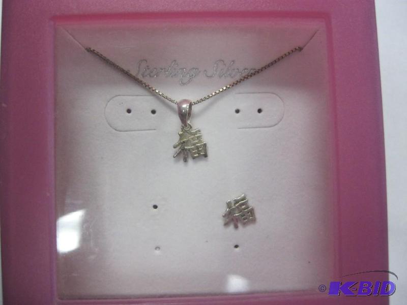 lot 37 image: Sterling silver Asian character necklace....
