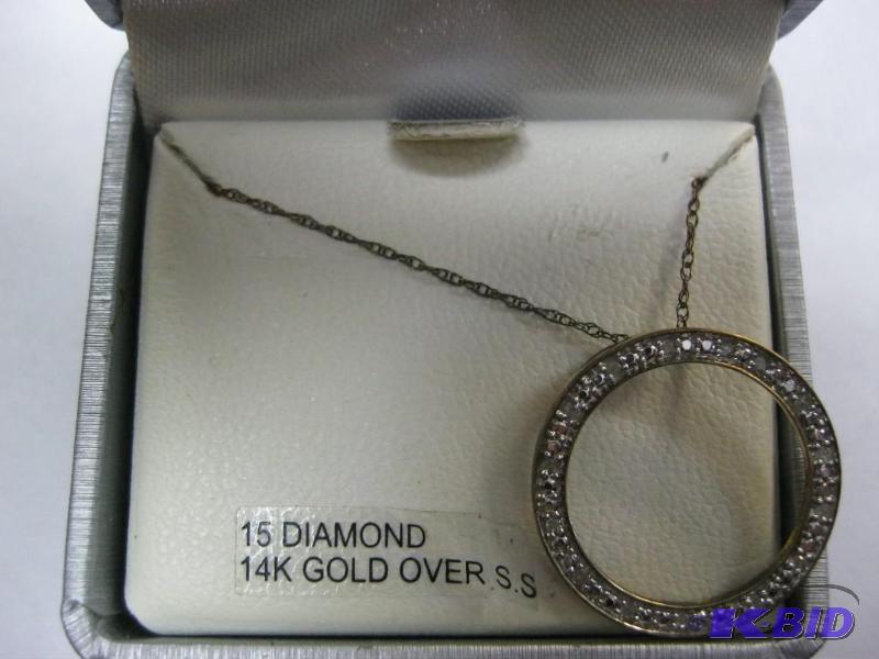 lot 42 image: Diamond and 14k over silver pennant and chain...