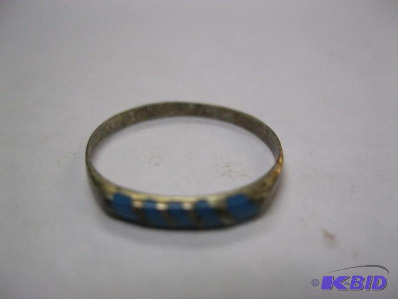 lot 45 image: Small silver ring with blue stones....