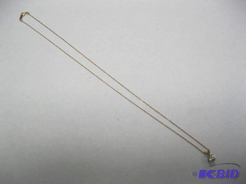 lot 46 image: 14k necklace with stone charm not sure what s...