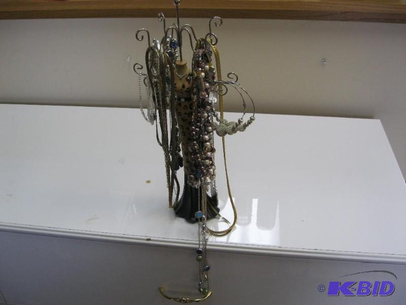 lot 57 image: Huge lot of Costume jewelry with stand....