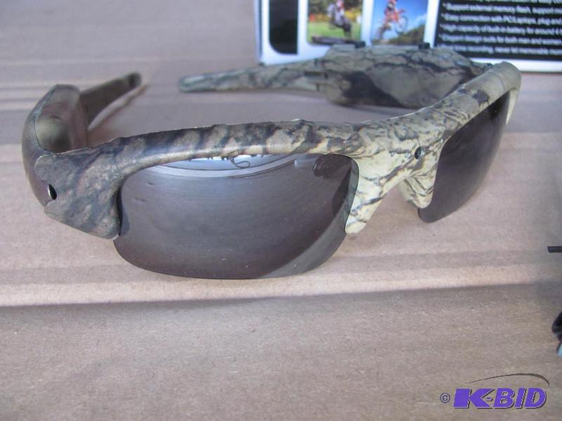lot 43 image: Check out these cool camo sunglasses with bui...