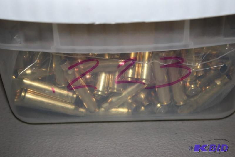 lot 611 image: Bin of 223 Winchester casings app. 600 ct....