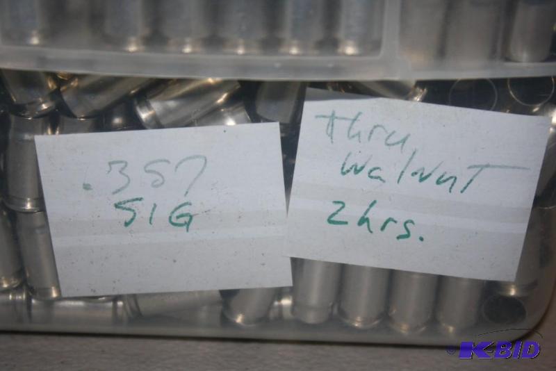 lot 612 image: Bin of 357 Sig casings app. 2500 ct....