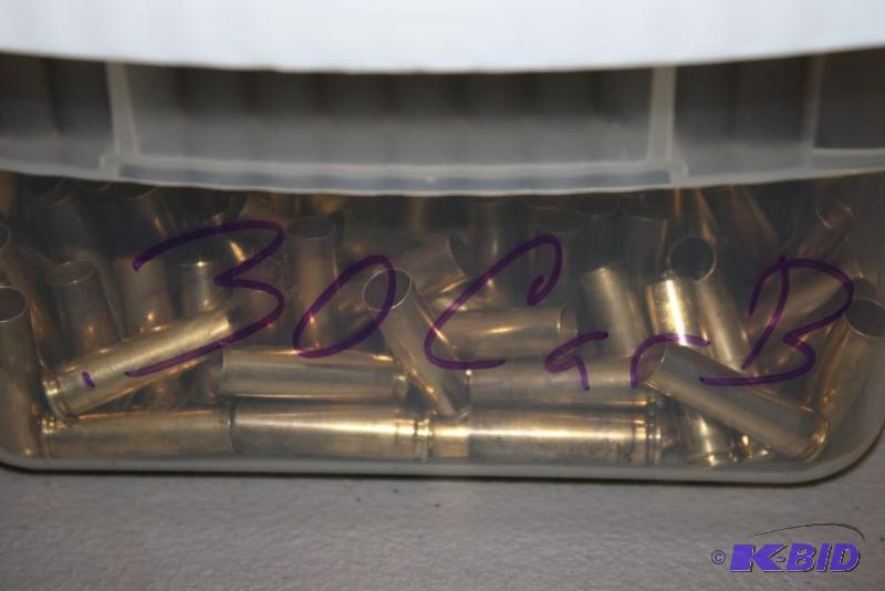 lot 615 image: Bin of 30 Carbine casings app. 200 ct....
