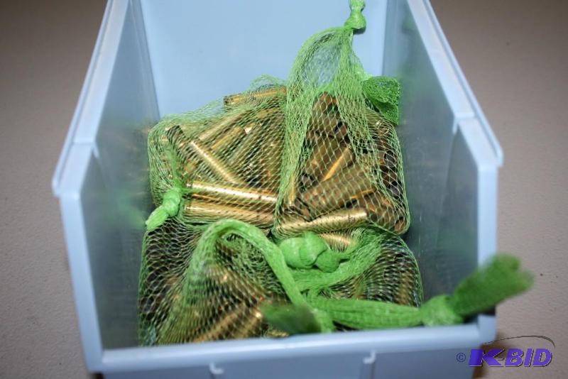 lot 651 image: Bin lot of 35 Remington casings app. 150 ct....