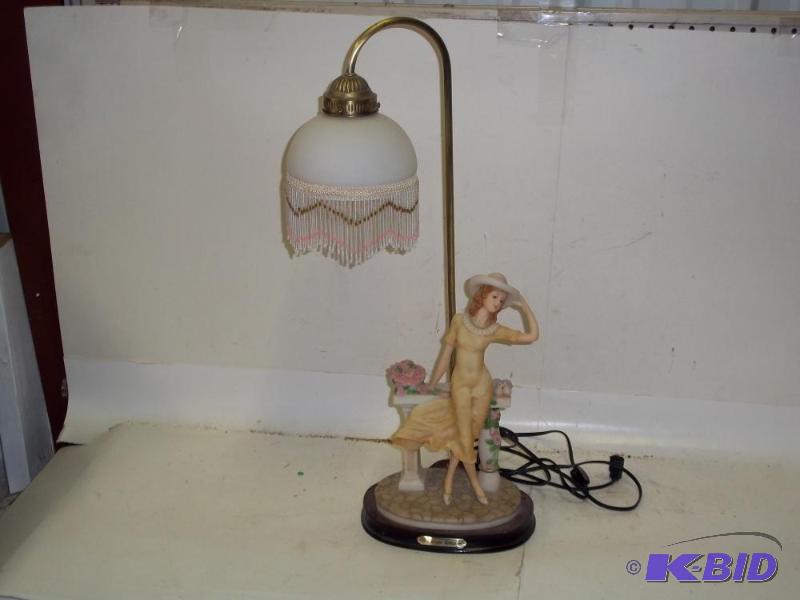 lot 115 image: Lamp with woman and hanging shade...