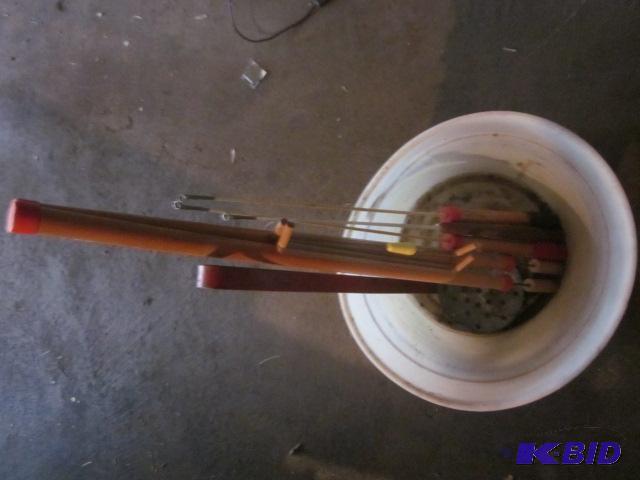 Lot of ice fishing rods and scoop.&nbsp...