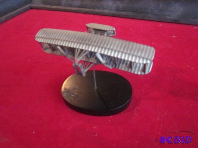 Small metal Biplane on wooden base.&nbsp...