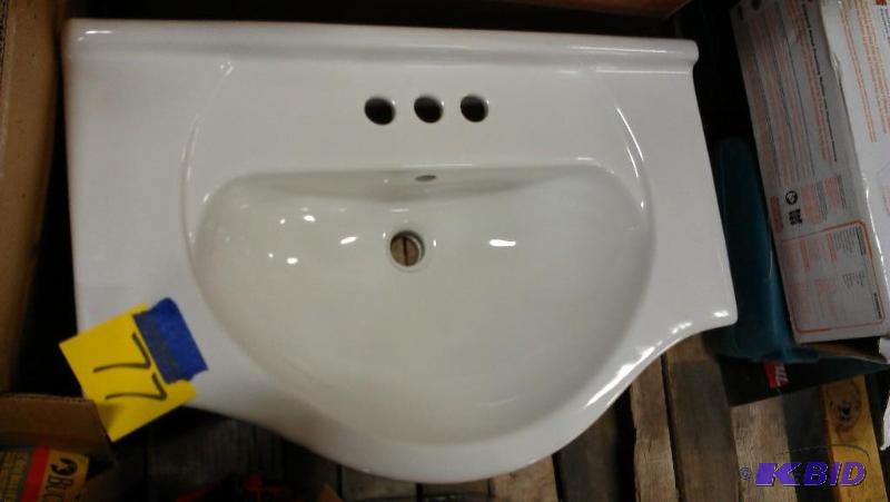 lot 77 image: Upscale bathroom sink. White. Rounded front e...