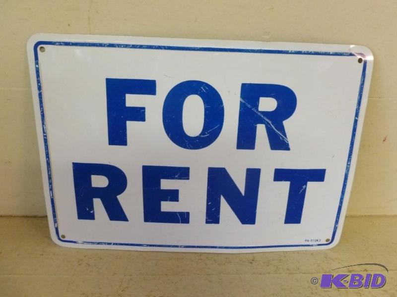 lot 28 image: For Rent metal sign that measures 7" x 1...