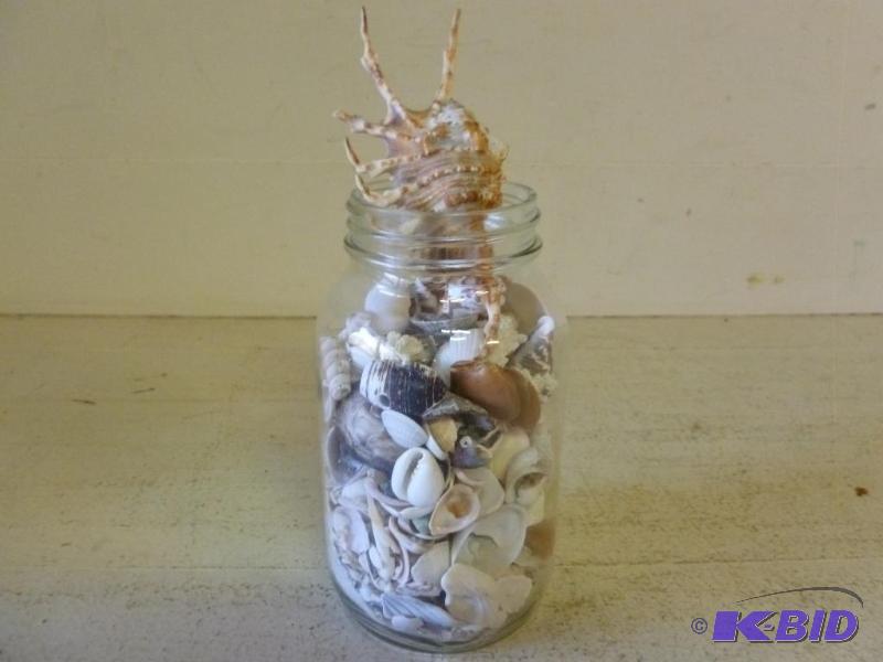 lot 54 image: Large glass canning jar filled with decorativ...