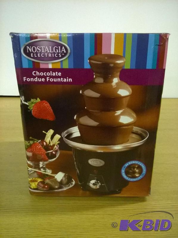 lot 38 image: Nostalgia Electrics CFF965 Mini Chocolate Fondue Fountain