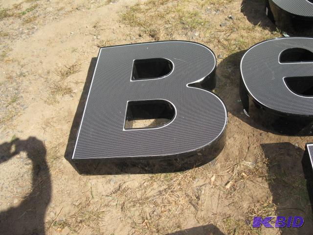 The letter B, lighted sign with wiring, appea...