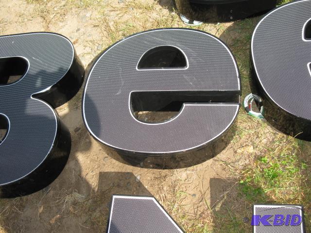 The letter e, lighted sign with wiring, appea...
