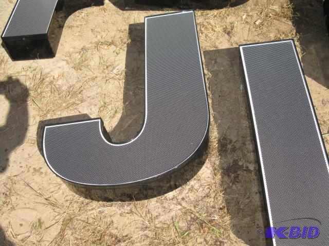 The letter J, lighted sign with wiring, appea...