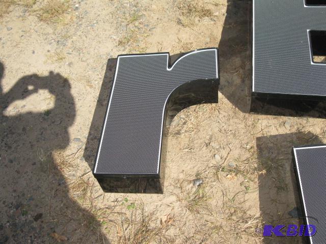 The letter r, lighted sign with wiring, appea...