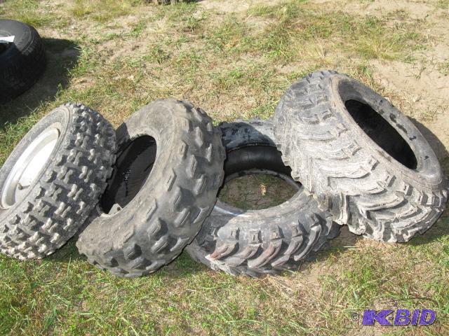 4 ATV tires, 1 with bent rim...