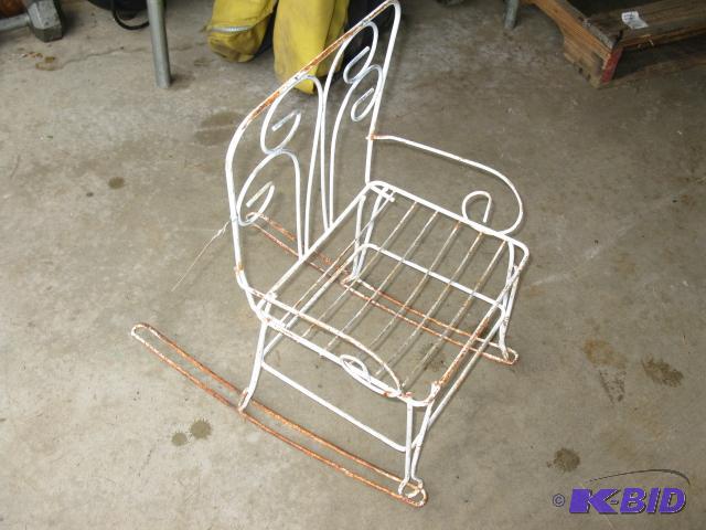 Small chair, probably was a plant stand....