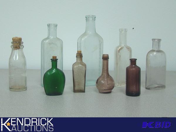 lot 43 image: Lot of Collectible Vintage Glass Bottles