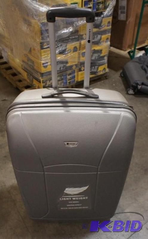 lot 15 image: New Delsey Hard Case Luggage Bag. MSRP $119. ...