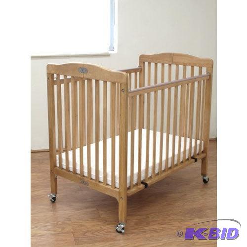 lot 53 image: L.A. Baby CW883A Folding Wood Crib with Mattress