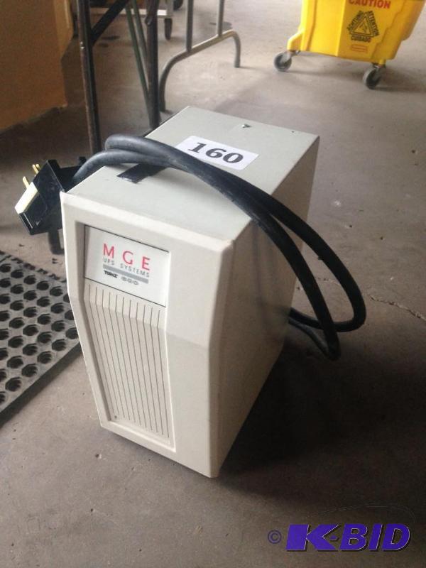lot 160 image: Heavy duty MGE UPS system battery backup....