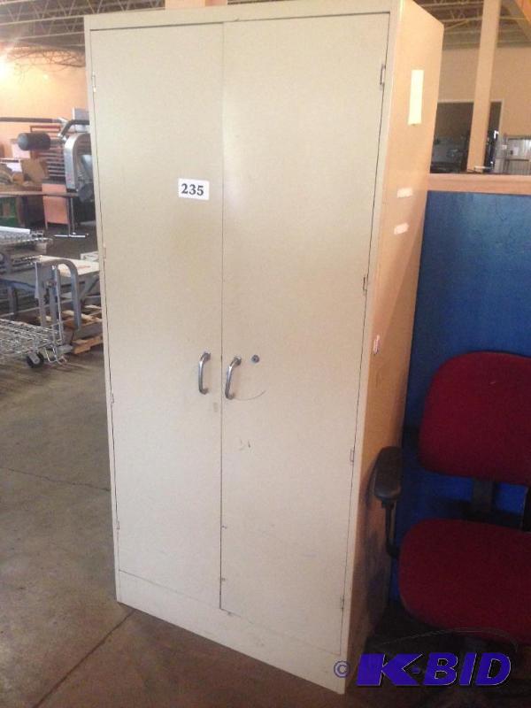 lot 235 image: 2 door upright metal cabinet....
