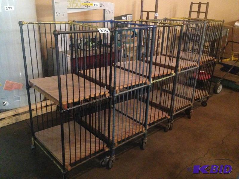 lot 270 image: Lot of 5 metal rack units on casters....