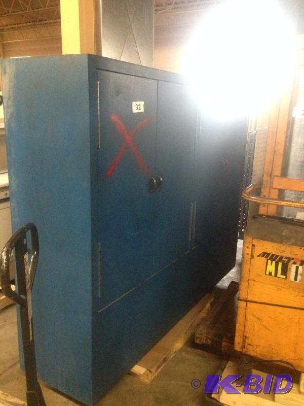 lot 32 image: Large wooden cabinet unit (was being used for...