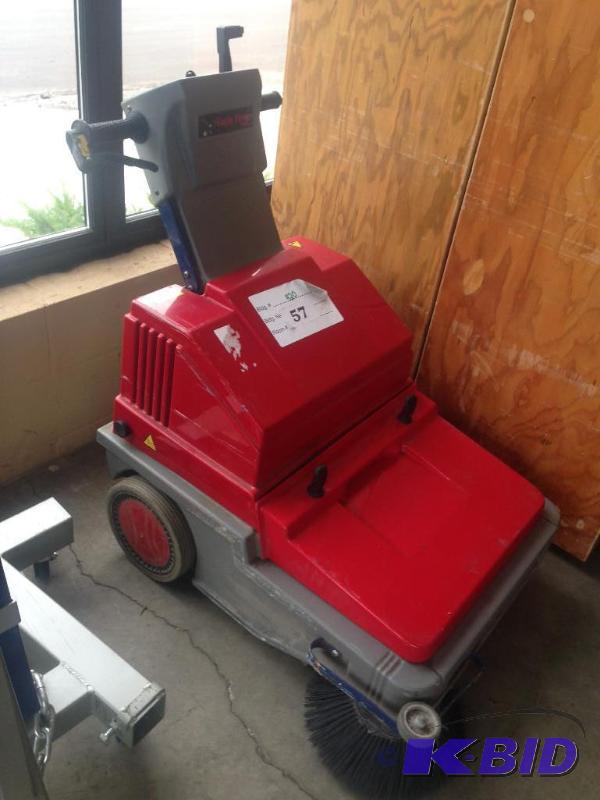 lot 57 image: Eagle powered floor sweeper. Battery is curre...