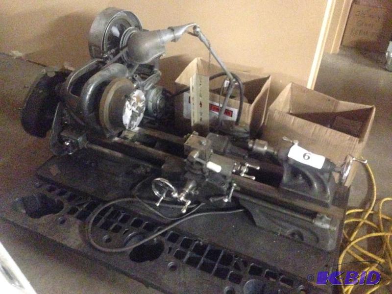 lot 6 image: Atlas bench top lathe. Comes with tooling as ...