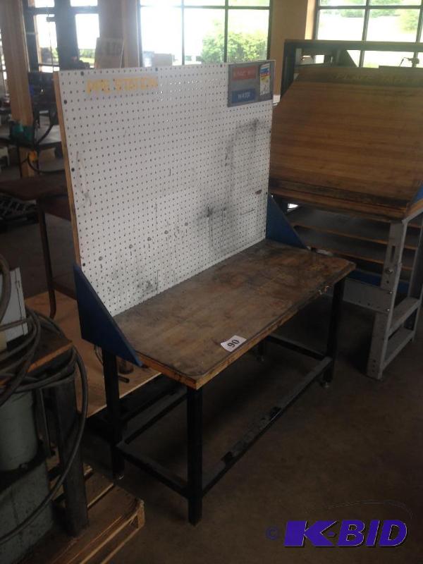 lot 90 image: Work bench with pegboard back....