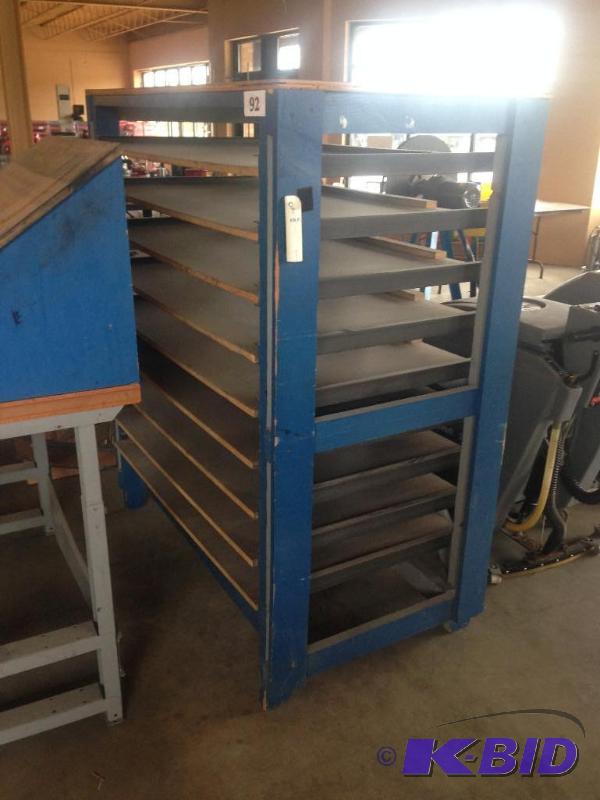 lot 92 image: Wooden rack with several shelves....