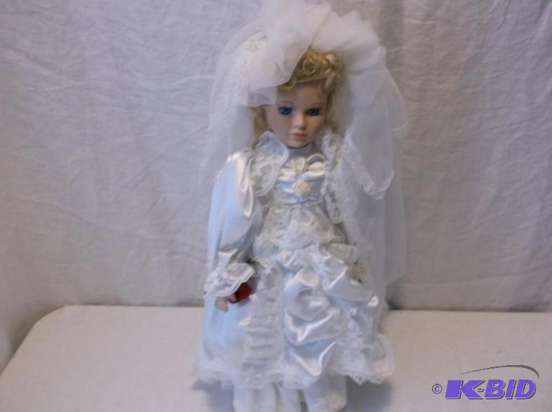 Beautiful porcelain doll on stand appear in g...