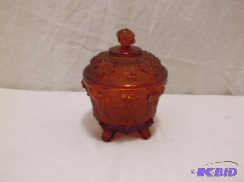 Beautiful ruby red foot candy dish appears in...