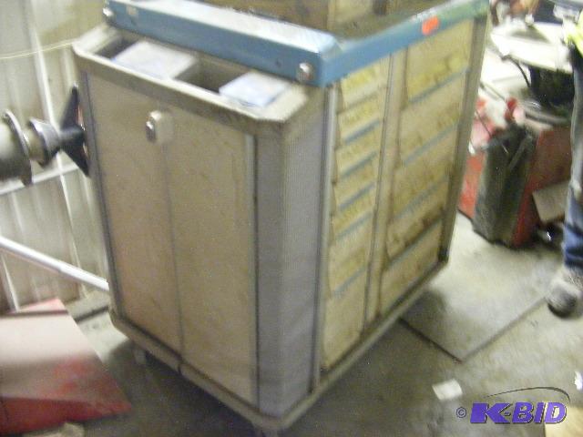 lot 41 image: Cart full of tire lug nuts, parts, valve stem...