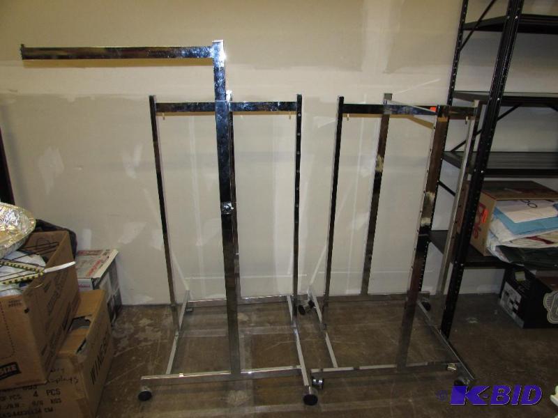 Two Rolling Clothing Racks, between the two t...