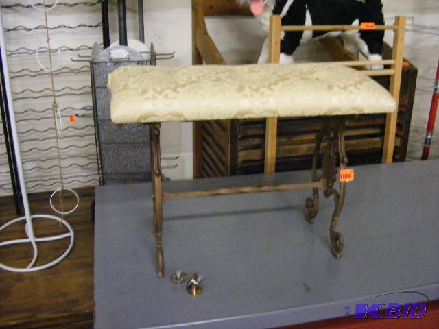 Wrought Iron Bench with padded seat. Approx 2...